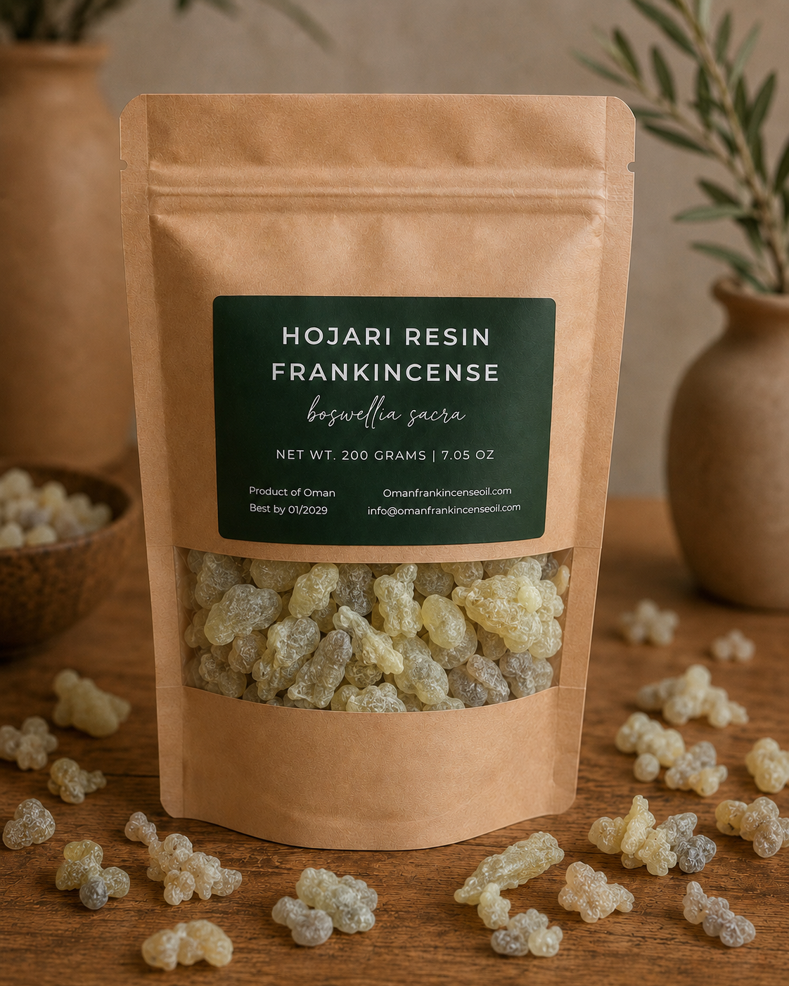 A 200 gram kraft pouch of Premium Hojari frankincense resin from Oman, with a dark green label and a clear window showing natural cream, pale green, and golden resin pieces.