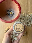 Tin of Frankincense & Myrrh Sacred Salve displayed with a traditional Omani frankincense burner and authentic Boswellia sacra frankincense resin in the background.
