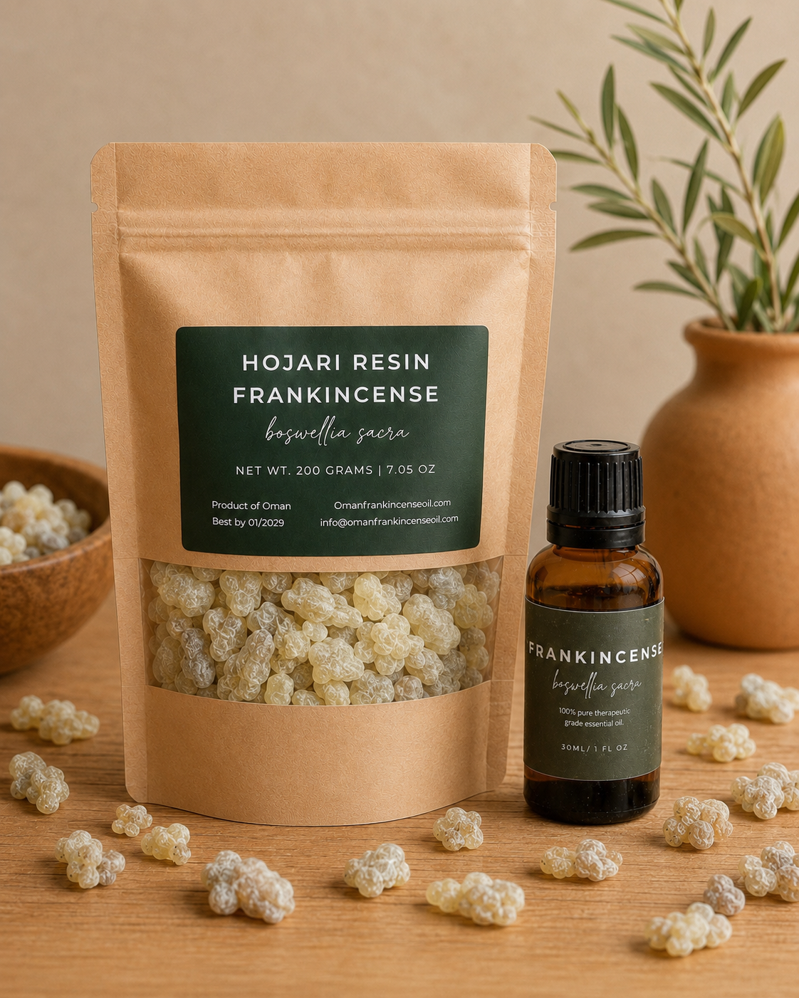 A kraft paper stand-up pouch labeled 'Hojari Resin Frankincense' with a clear window showing pale resin pieces inside, next to a small amber bottle with a black cap and matching label. The scene is styled on a wooden surface with scattered resin pieces and a terracotta vase in the background.